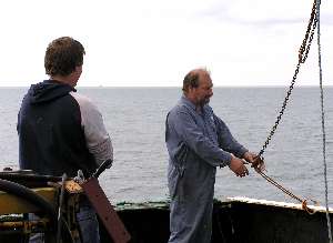 Securing hoist arm